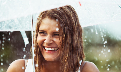 Smiling Woman in Rain